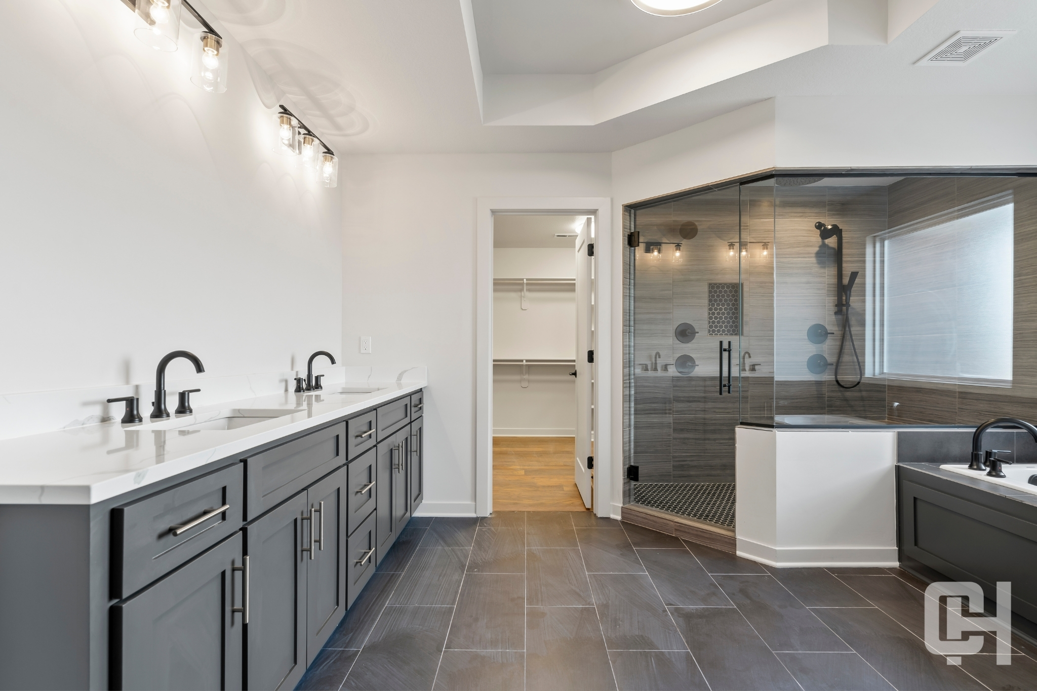 Justina Bathroom With Gray Vanity And Tiled Shower
