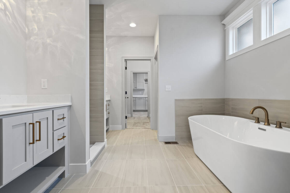 Modern Free Standing Bathtub In Primary Bathroom