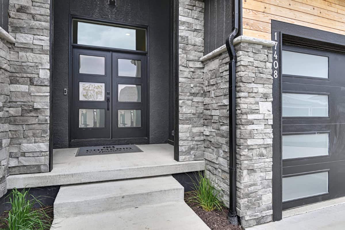 Modern Black Front Entry Door With Stone Exterior