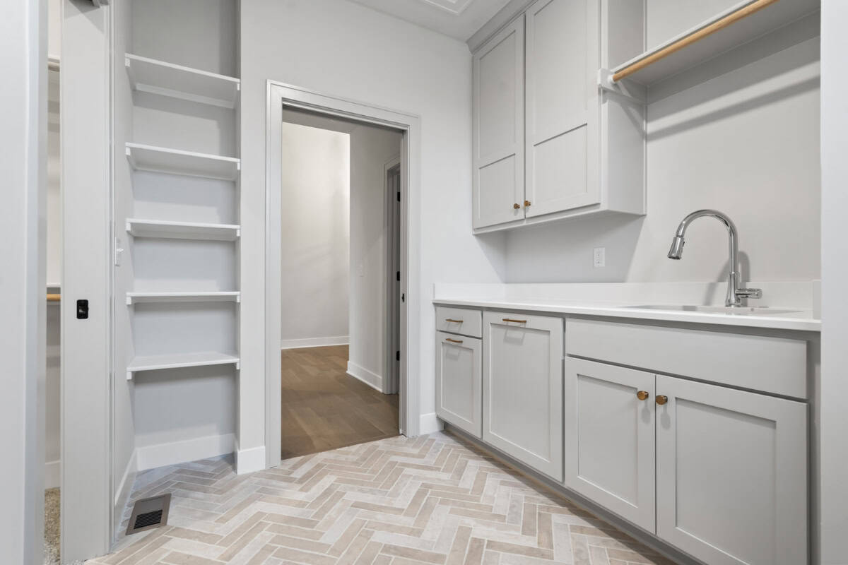 Laundry Room With Utility Sink And Storage
