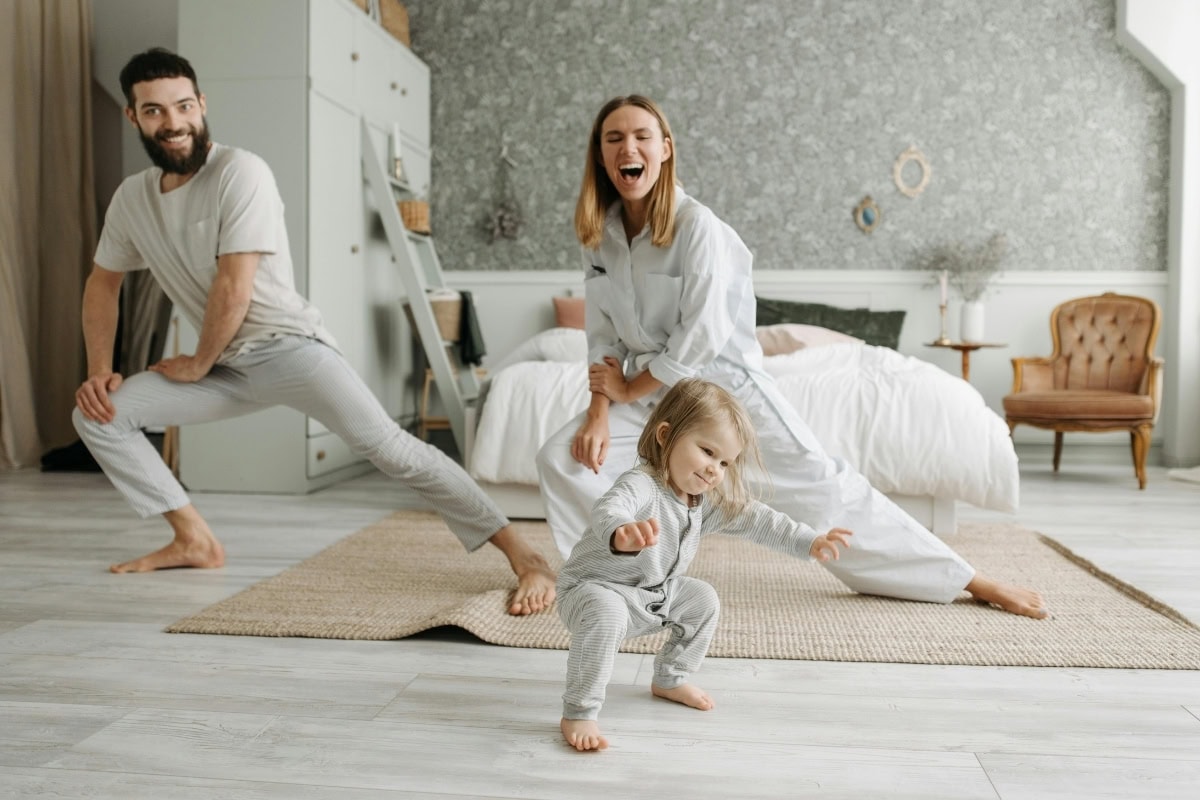 Playful family relaxing together in living room in Northwest Arkansas