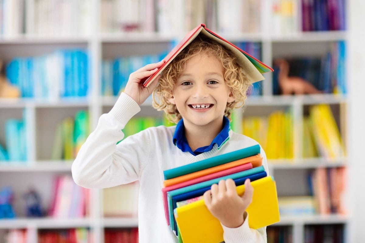 Student reading in bright Northwest Arkansas home office