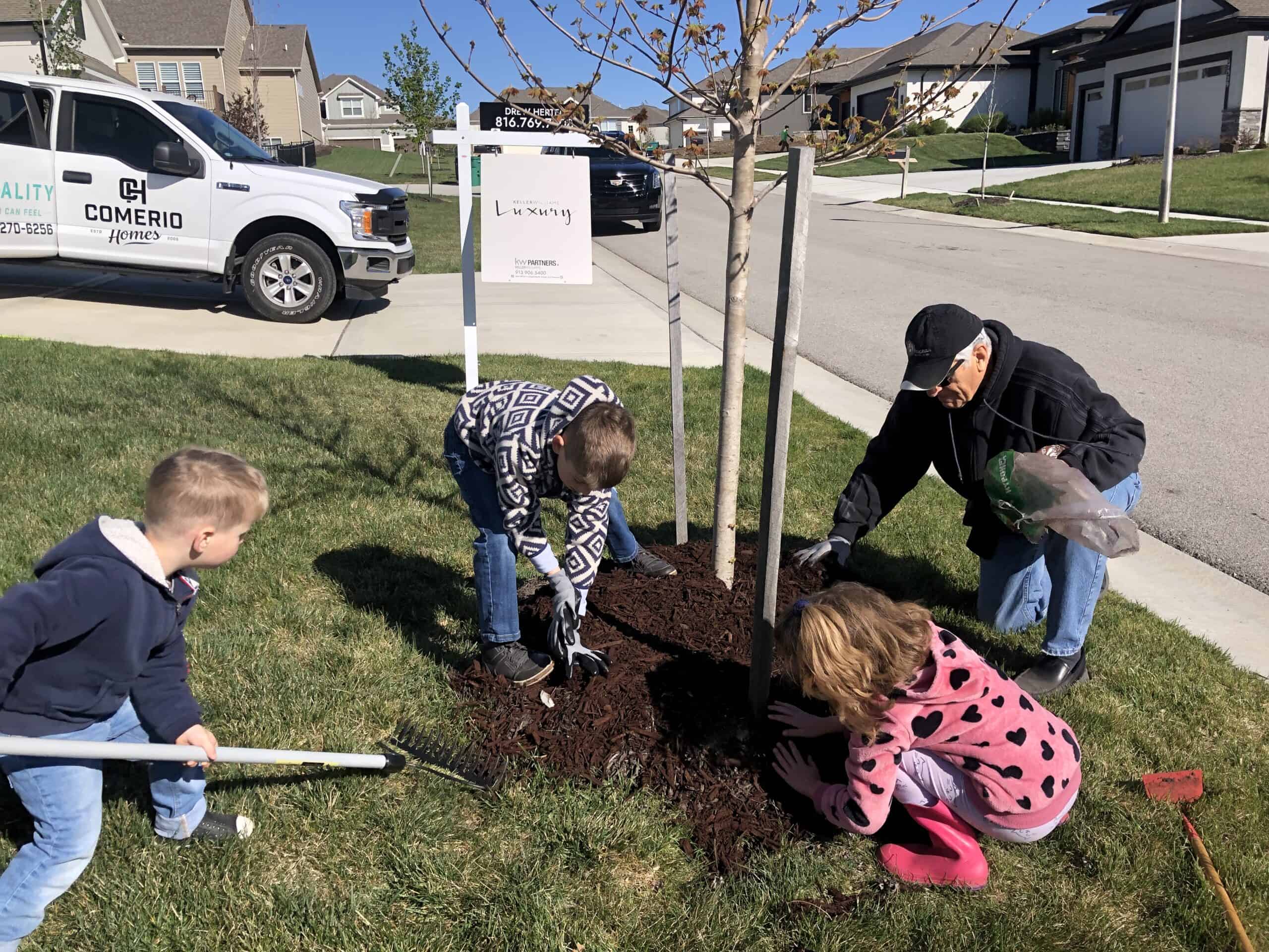 Comerio Family Planting A Tree In Northwest Arkansas Community