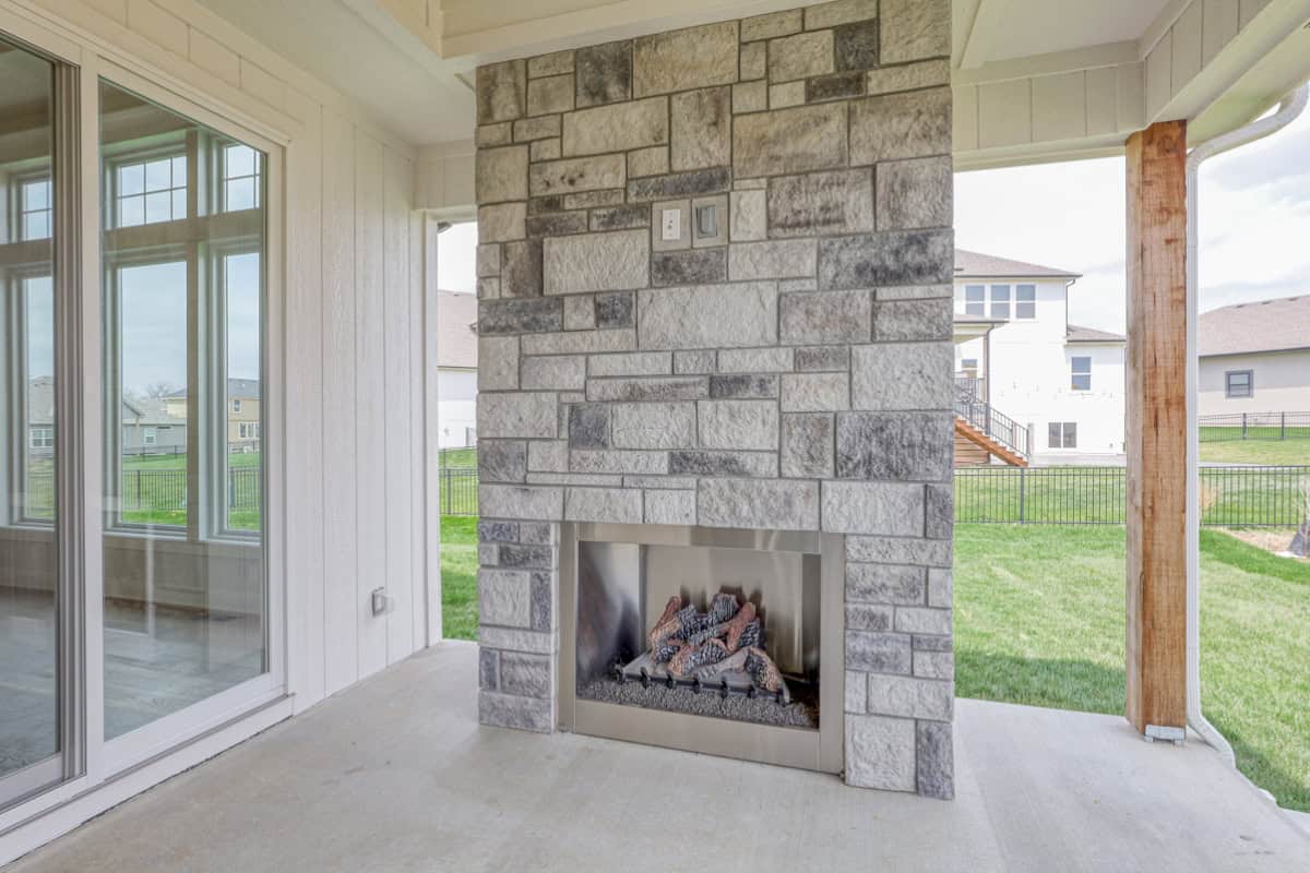 Stone Outdoor Fireplace On Covered Patio