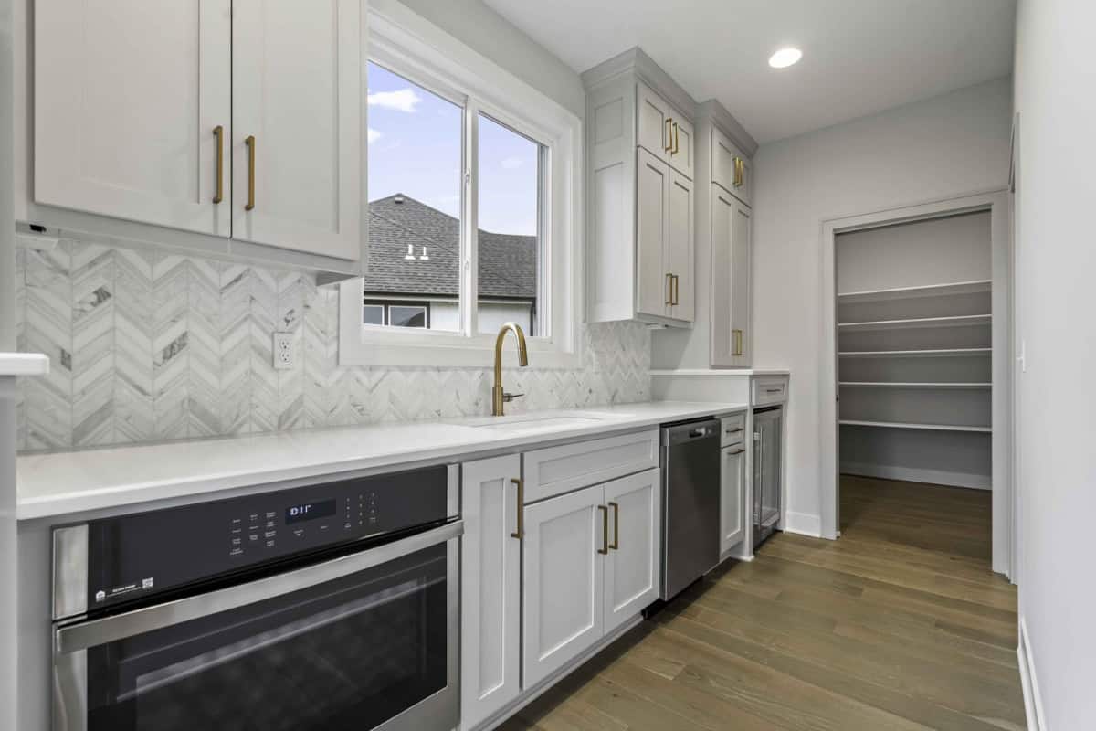 Modern Prep Kitchen With Cabinetry And Storage