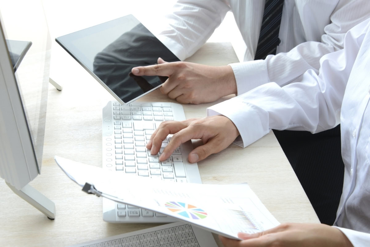 Team reviewing house plans in meeting