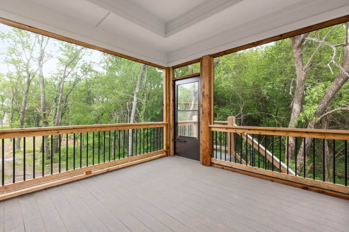 Screened In Porch With Wood Railing