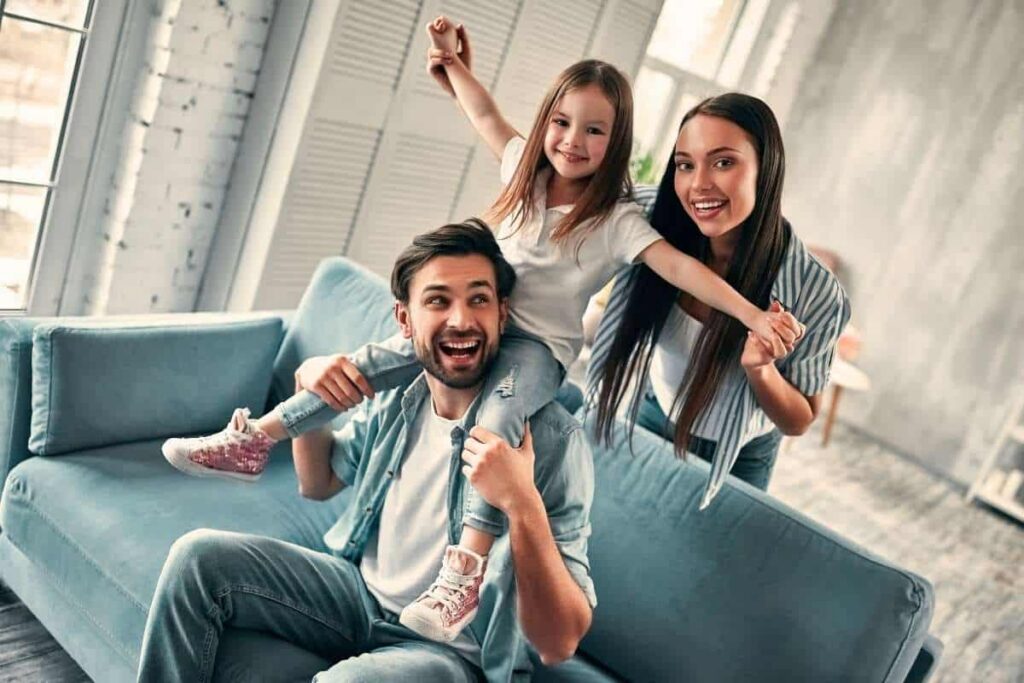 Happy Family Relaxing Together At Home In Tontitown Arkansas