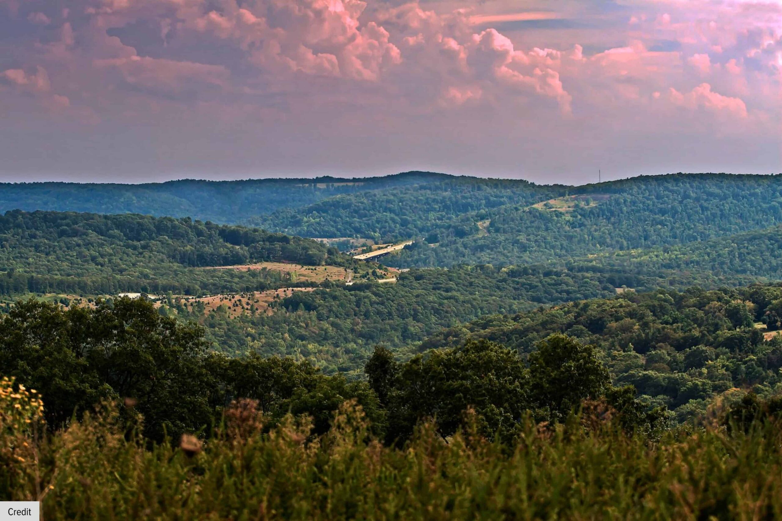 Scenic Overlook Of The Rolling Hills And Forests Surrounding Gravette, Arkansas.