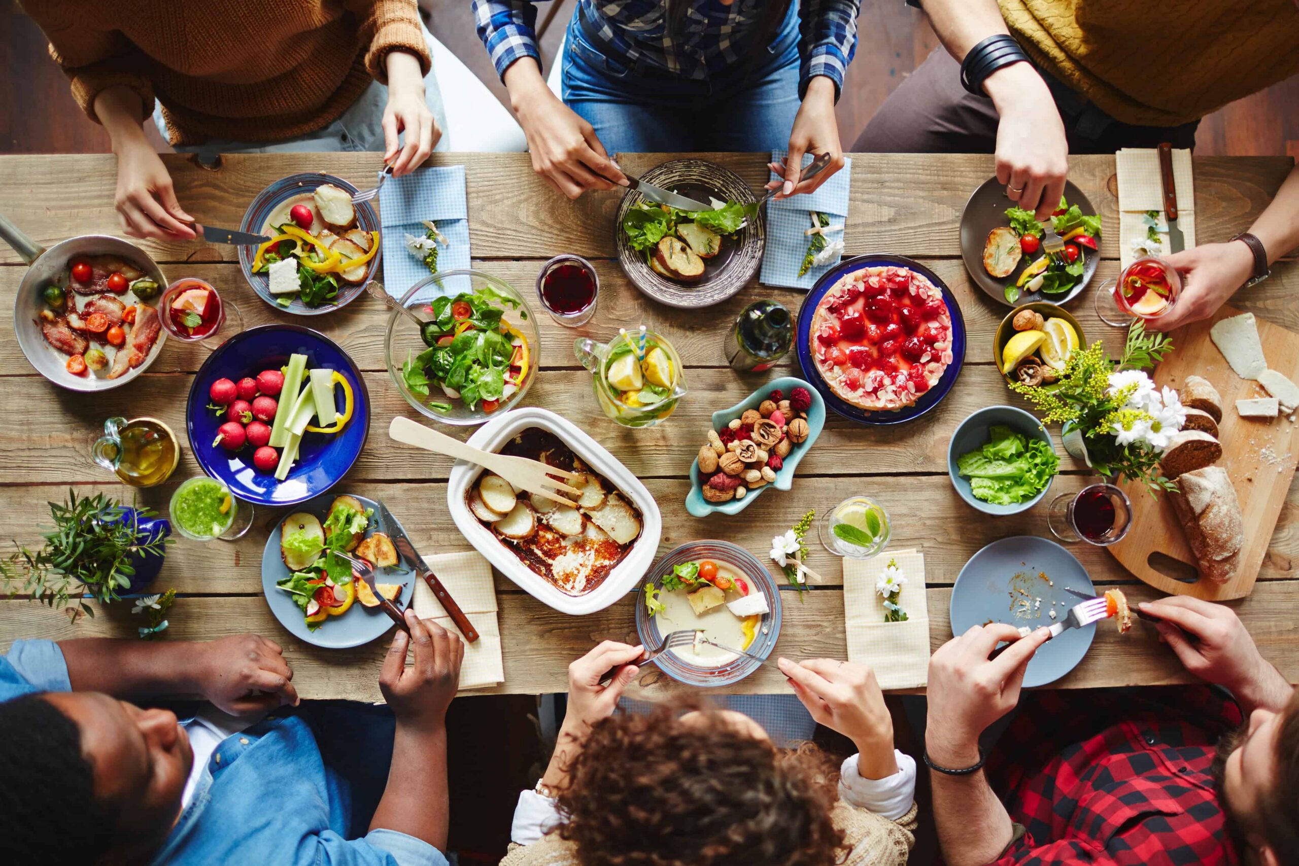 Friends sharing food and conversation at a casual Northwest Arkansas restaurant.