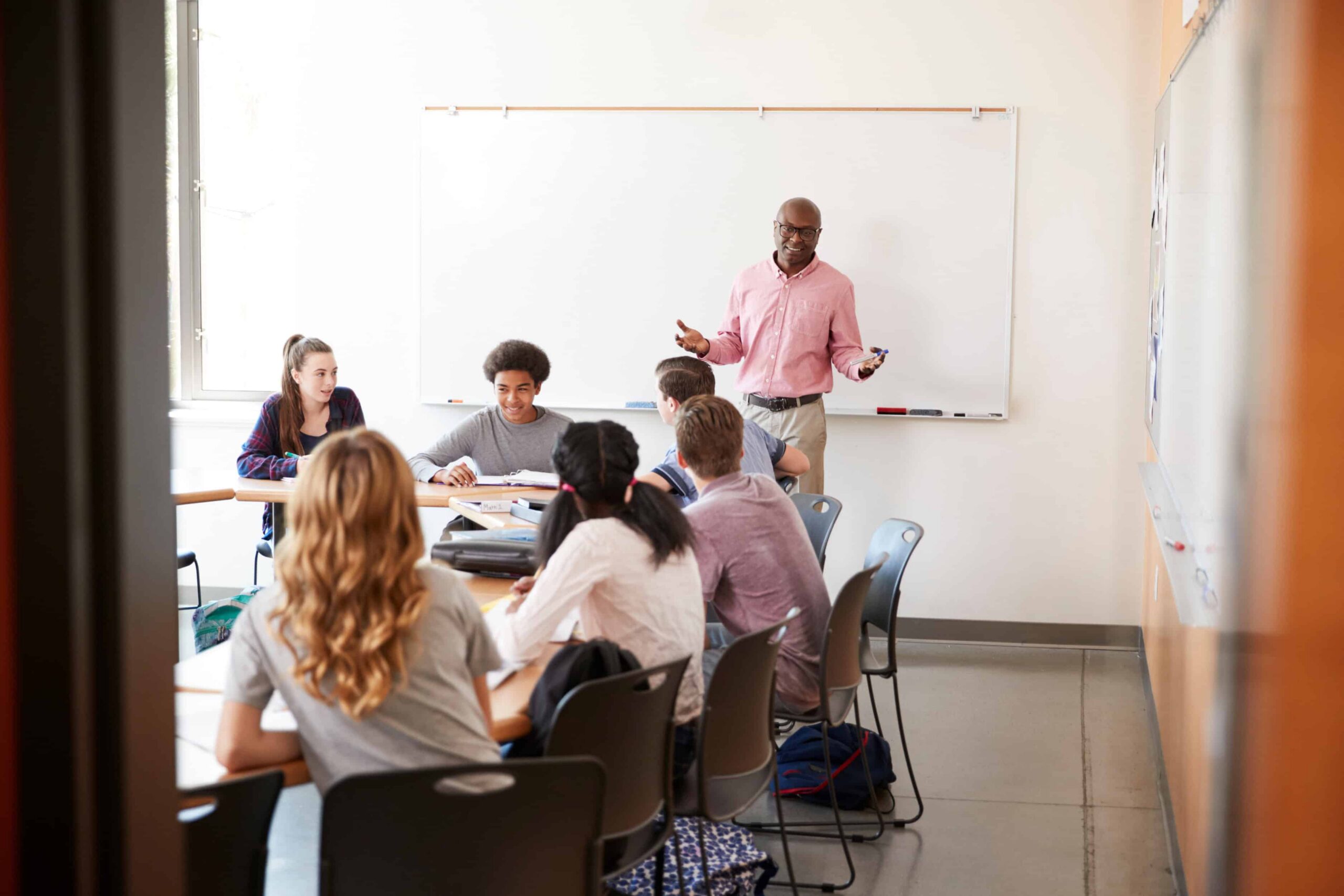 Students participating in an interactive lesson with classroom instruction.