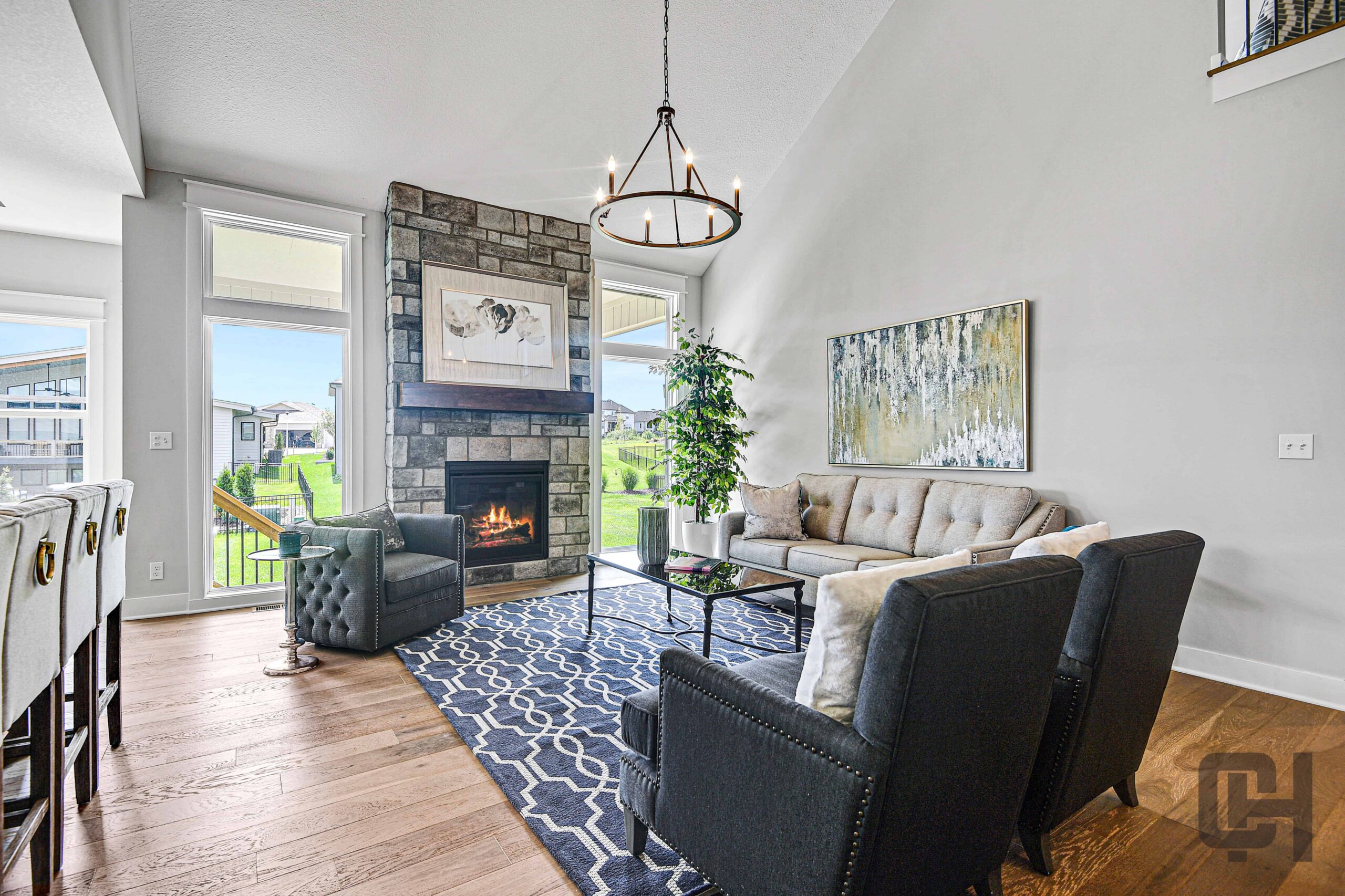 Bright living room with fireplace and comfortable seating in the Siena Story floor plan.